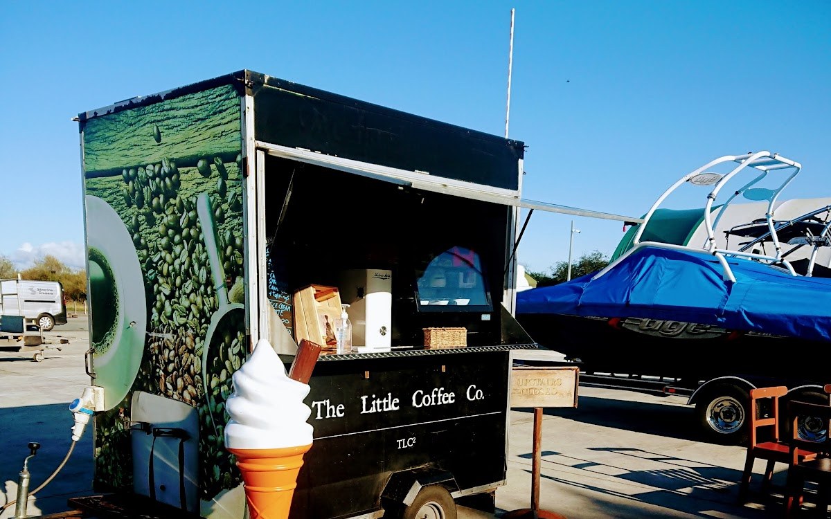 The Little Coffee Co black coffee trailer at Banagher Marina, with the hatch open and boats nearby